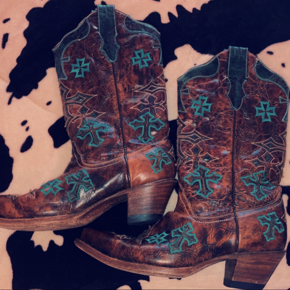 These are corral boots and they are barely worn with turquoise cross accents.